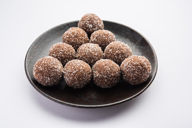 Premium Photo | Chocolate coconut laddu or laddoo is a twist to a ...