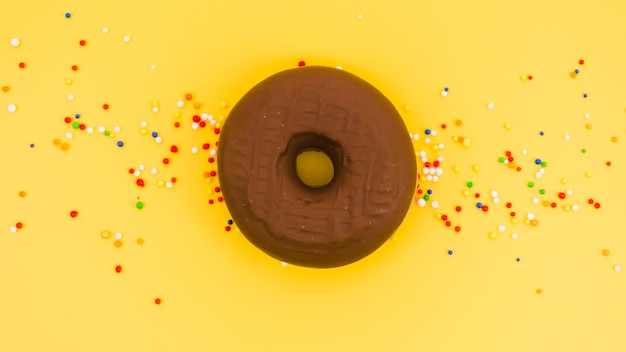 Download Free Photo Chocolate Donut With Colorful Sprinkles On Yellow Background Yellowimages Mockups