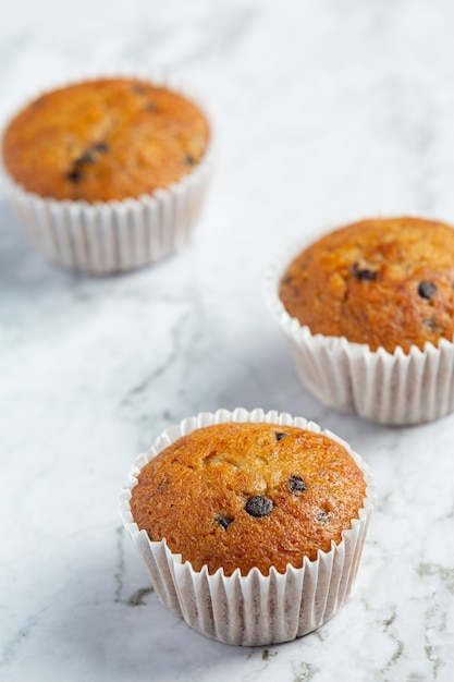 Free Photo | Chocolate muffins put on white marble floor