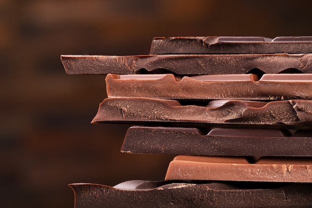 Premium Photo | Chocolate tower of dark chocolate bars, dessert food