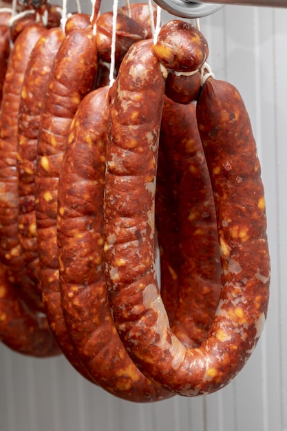 Premium Photo Chorizos Cured And Hung In Strings Sausages