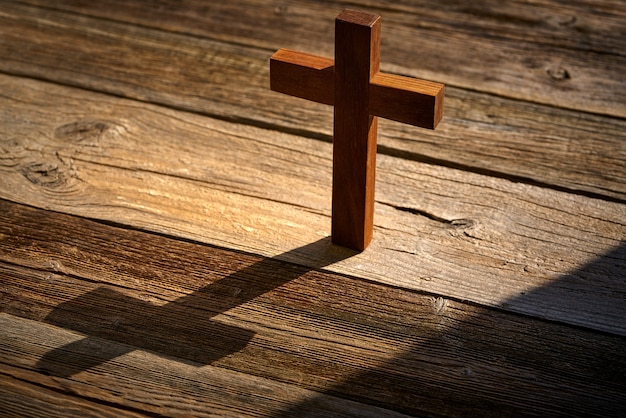 Premium Photo | Christian cross on wood over wooden