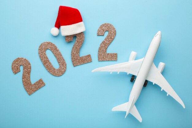 Christmas 2022 Airfare Premium Photo | Christmas Background With Airplane And Inscription 2022 On  Blue Background. Christmas Holiday