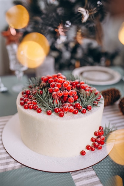 Free Photo | Christmas cake decorated with red berries