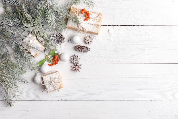 Christmas composition with frame of fir branches, christmas decorations and pine cones. flat lay, top view Premium Photo
