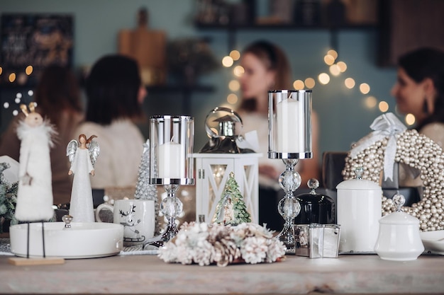 Free Photo | Christmas decor on a table with people in the background ...