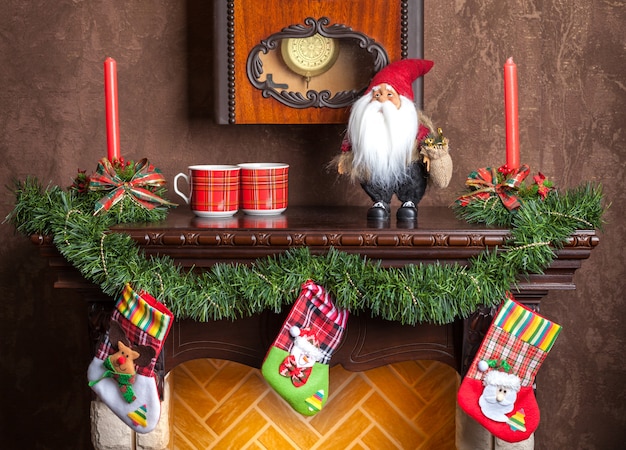 Christmas Decoration Of Fireplace Candles Garland And Socks