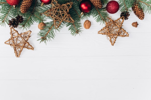 Christmas decoration on white wooden background. Photo | Premium Download