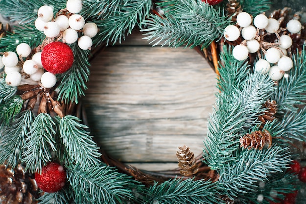 Premium Photo | Christmas decorative wreath on wooden background horizontal