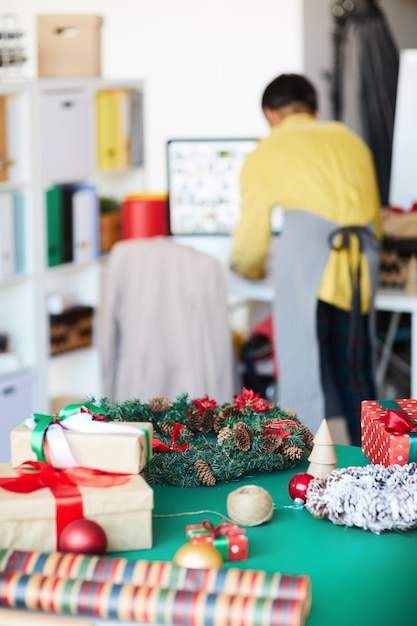 Free Photo | Christmas gifts and decorations over table