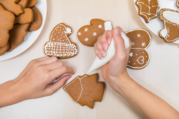 Christmas Gingerbread Painting The Child Is Icing The Drawing On The