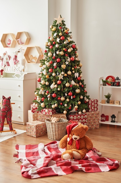 Download Premium Photo Christmas Interior Of Children S Bedroomchristmas In The Nursery Soft Toy Bear On Background Of Christmas Tree PSD Mockup Templates