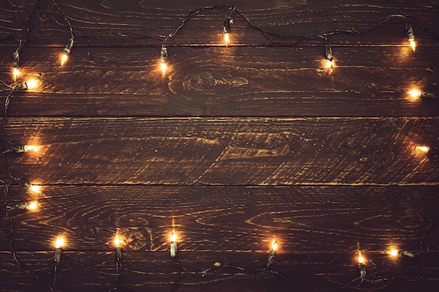 Christmas lights bulb on wood table. Merry christmas (xmas ...