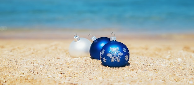 Premium Photo | Christmas ornaments on the beach