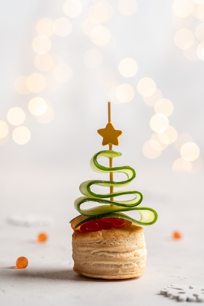 Premium Photo | Christmas tree canape with cucumber and salmon