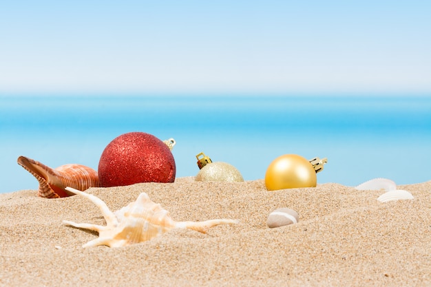 Premium Photo | Christmas tree decorations on the beach in tropical ...