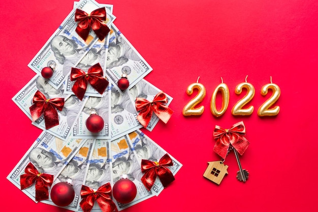 Keys For Christmas 2022 Premium Photo | Christmas Tree Made Of 100 Dollar Bills And House Key,  Candles With The Numbers 2022. Christmas Decor Of Finance, Savings, Wealth,  Expenses In New Year. Real Estate, Housing, Mortgage, Relocation