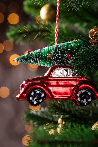 Christmas tree toy in shape of red car | Premium Photo