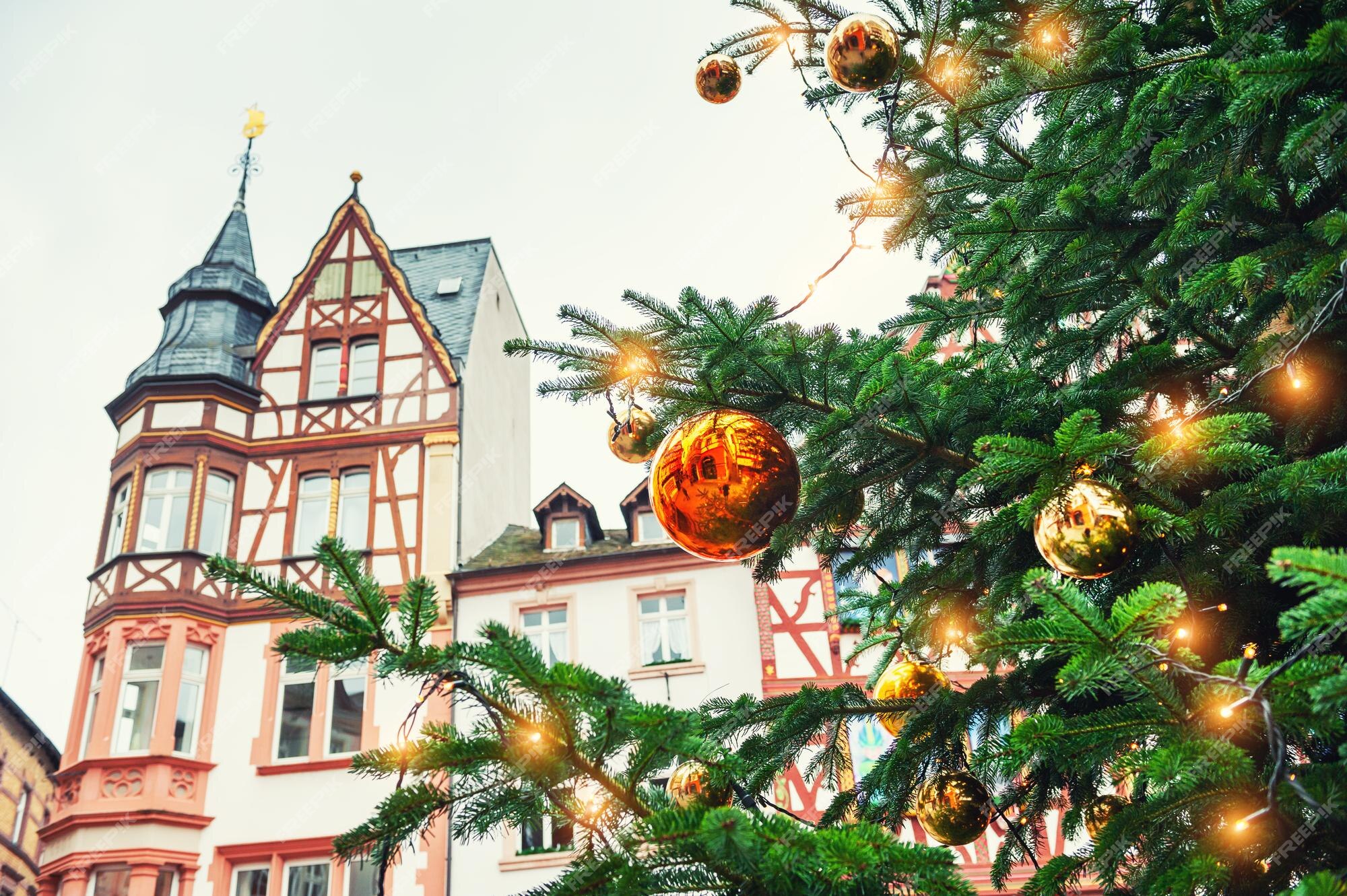 Premium Photo | Christmas tree with golden balls on the market square