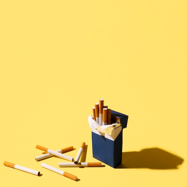 Download Free Photo Cigarettes Pack On Yellow Background PSD Mockup Templates