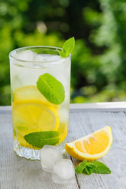 Premium Photo | Citrus fresh lemonade in garden setting