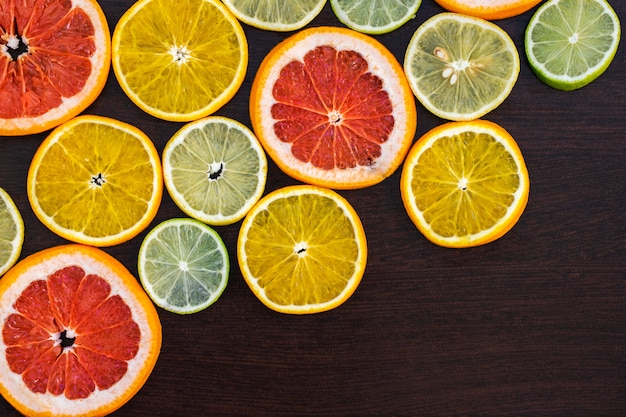 Premium Photo Citrus Fruit Cut In Half Oranges Lemons Lime Tangerines Grapefruit On A Wooden Background
