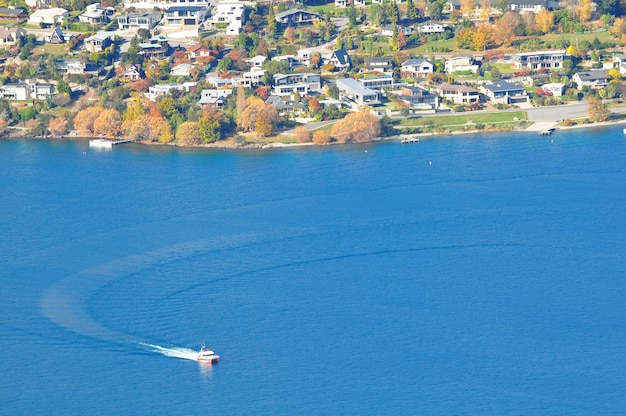 Premium Photo | City view with boat on a sea landscape