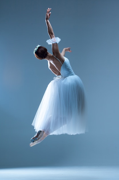 Free Photo | Classic ballerina dancing on blue