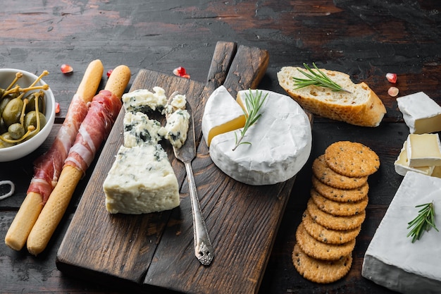 Premium Photo | Classic italian antipasti set, on dark wooden table