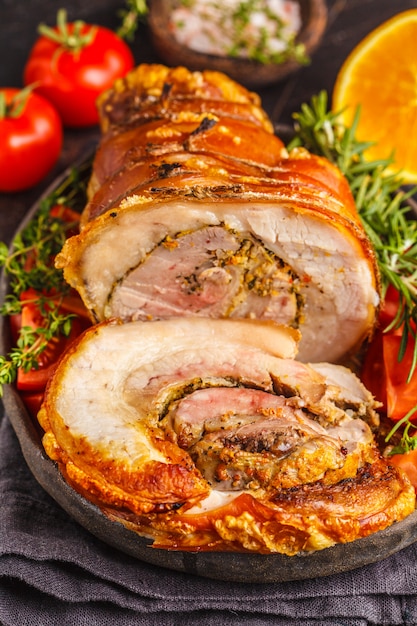 Premium Photo | Classic italian baked porchetta with oranges.