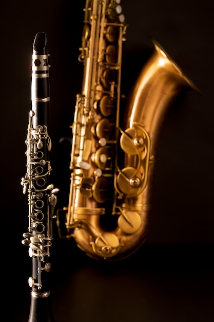 Classic music sax tenor saxophone and clarinet in black | Premium Photo