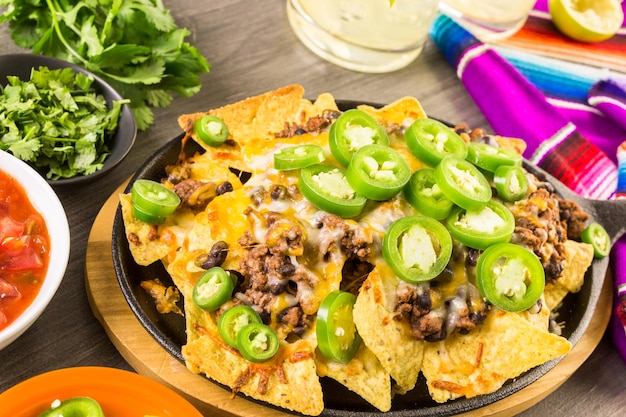 Premium Photo Classic Nachos With Ground Beef And Fresh Jalapeno Chili Peppers 3181