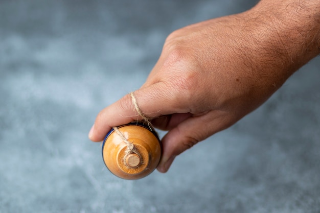 spinning top toy with string