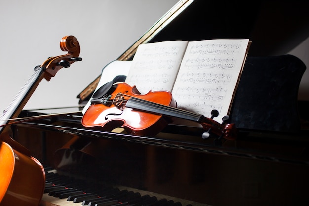 Premium Photo | Classical music concept: cello, violin, piano and a score