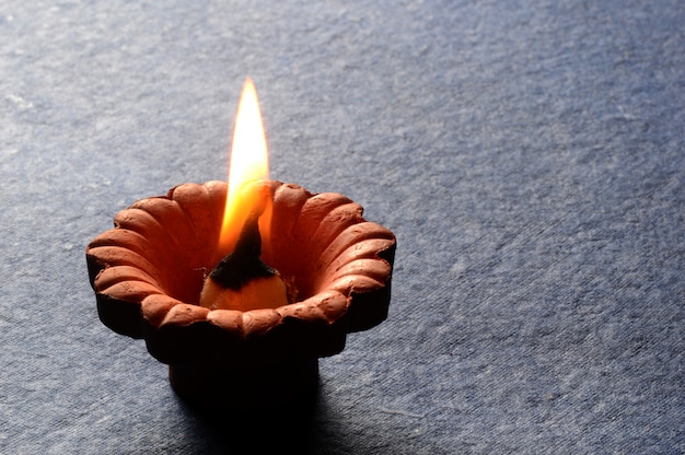 Premium Photo | Clay Diya Lamps Lit During The Celebration Of Indian ...