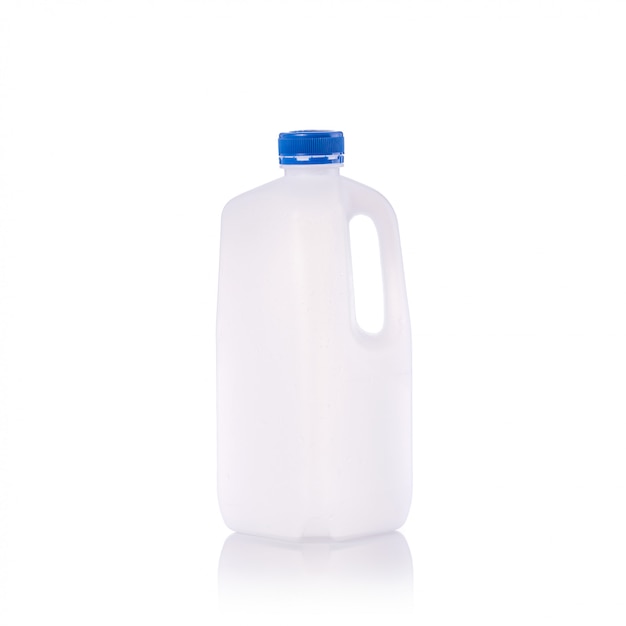 Premium Photo | Clear blank empty milk bottle with blue cap.