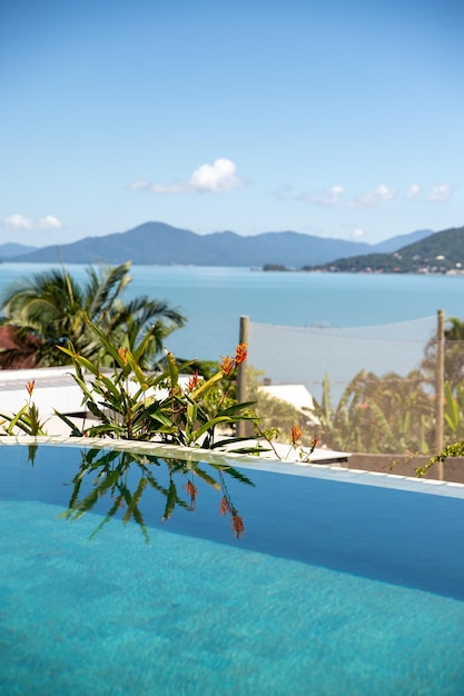 Premium Photo | Clear blue water by the pool relaxing at the beach ...