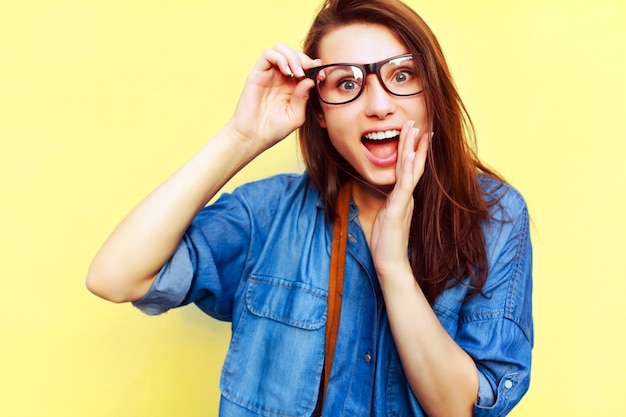 Free Photo Closeup Of Astonished Girl Touching Her Glasses