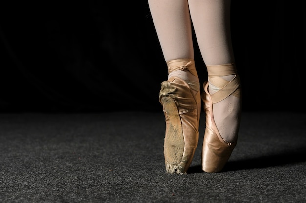 Close-up of ballerina feet with pointe shoes | Free Photo