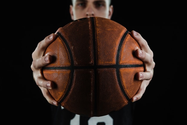 Premium Photo Close Up Of Basketball Player Showing The Ball