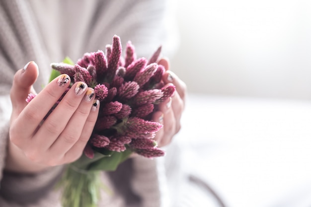 Free Photo Close Up Of Beautiful Female Hands Holding Big White Cup Of Cappuccino Coffee And Flowers