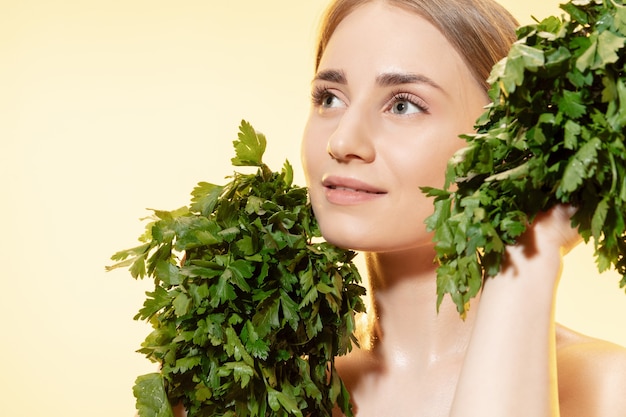 Premium Photo Close Up Of Beautiful Young Woman With Green Leaves On White Background