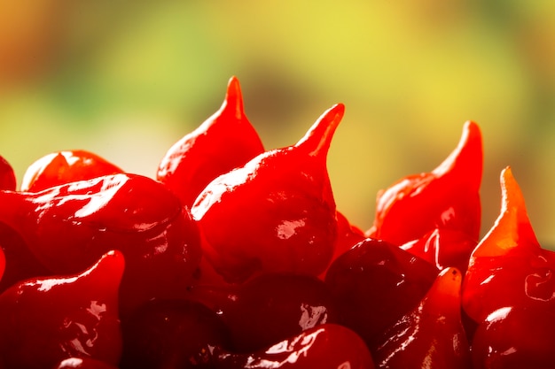 Premium Photo Close Up Biquinho Red Pepper Capsicum Chinense Over A Wooden Table 4016