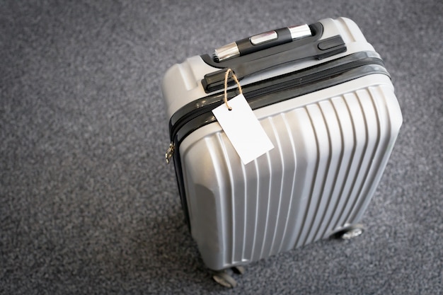Premium Photo | Close up of blank luggage tag label on a suitcase
