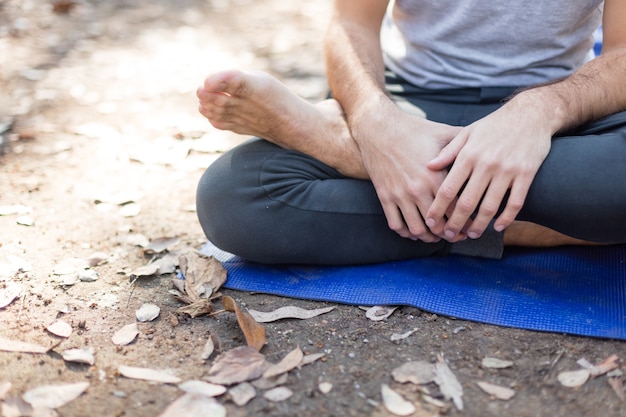 Free Photo | Close-up of boy sitting cross-legged