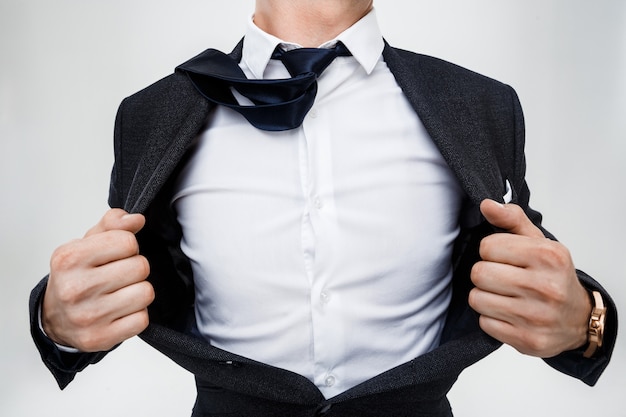 close-up-of-businessman-taking-jacket-off-free-photo