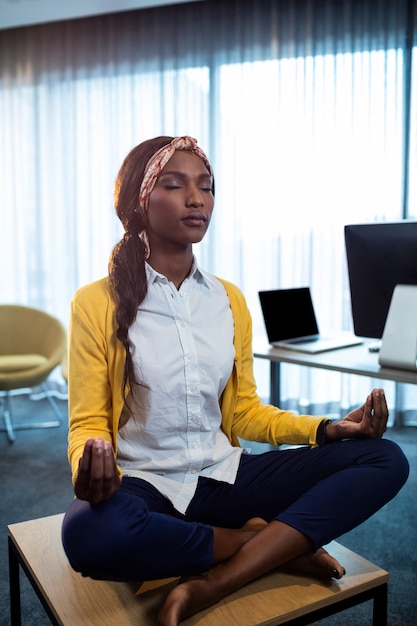 Premium Photo | Close up of businesswoman doing yoga