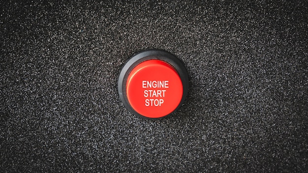 Close up on buttons with letters indicating starting the engine or electrical engine. Premium Photo