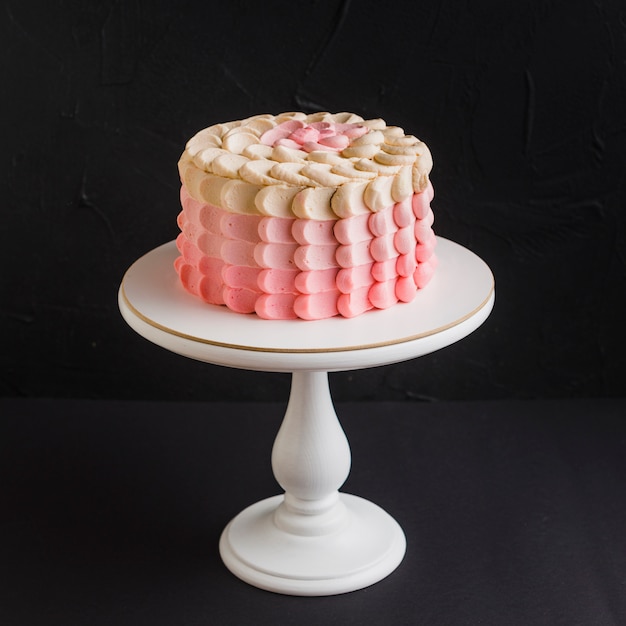 Free Photo Close Up Of A Cake On Cakestand Over Black Background