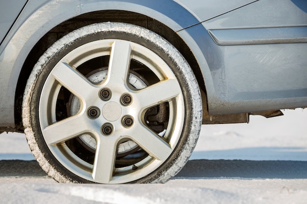 Close-up of car wheels rubber tire in deep snow Premium Photo